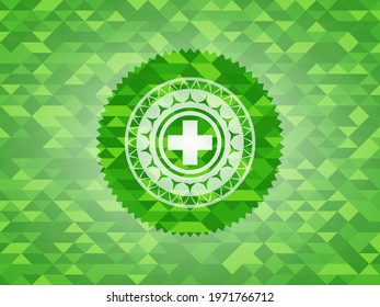 medicine icon inside green mosaic emblem. 