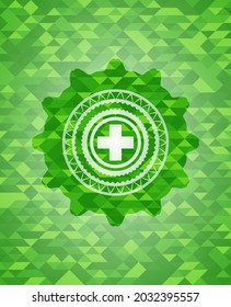 medicine icon inside green mosaic emblem. 