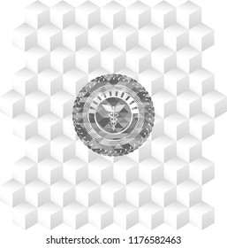 medicine icon inside grey icon or emblem with geometric cube white background
