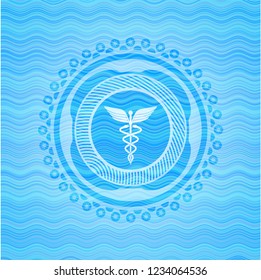 medicine icon inside light blue water wave style emblem.