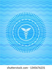 medicine icon inside light blue water style badge.