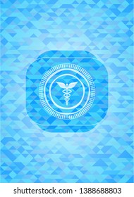 medicine icon inside light blue mosaic emblem