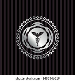 medicine icon inside silver emblem or badge