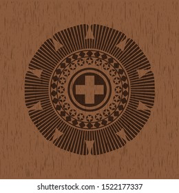 medicine icon inside wooden emblem