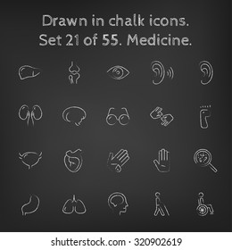 Medicine icon set hand drawn in chalk on a blackboard vector white icons on a black background.