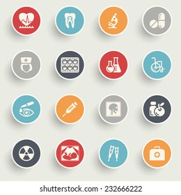 Medicine icons with color buttons on gray background.