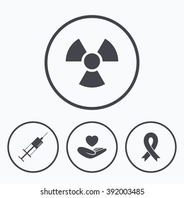 Medicine icons. Syringe, life insurance, radiation and ribbon signs. Breast cancer awareness symbol. Hand holds heart. Icons in circles.