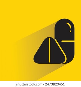 medicine pill with shadow on yellow background