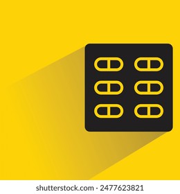 medicine tablet icon with shadow on yellow background