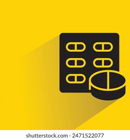 medicine tablet and pill icon with shadow on yellow background