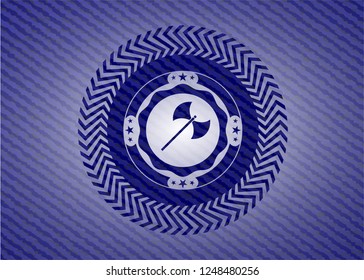 medieval axe icon inside badge with denim texture