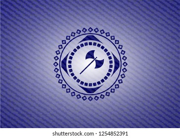 medieval axe icon inside badge with denim texture