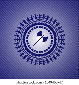 medieval axe icon inside badge with denim texture