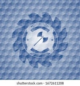 icono medieval de hacha dentro del emblema azul con motivos geométricos.