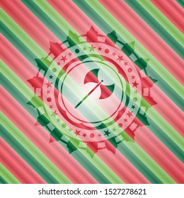 medieval axe icon inside christmas colors style badge.