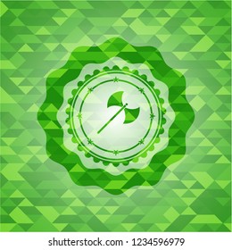 medieval axe icon inside green mosaic emblem