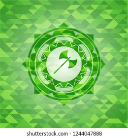 medieval axe icon inside green emblem with triangle mosaic background