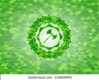 medieval axe icon inside green emblem. Mosaic background