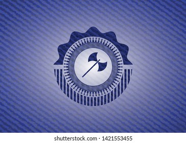 medieval axe icon inside jean or denim emblem or badge background