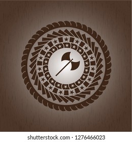 medieval axe icon inside wood badge or emblem