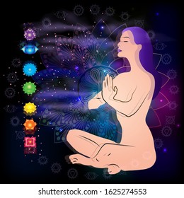 Meditating woman in lotus pose in universe beside the stars. Yoga, esoterics;  aura glow. 