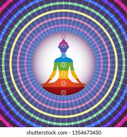 Meditating yoga girl silhouette in shining colorful circle with concetric rings on night sky background