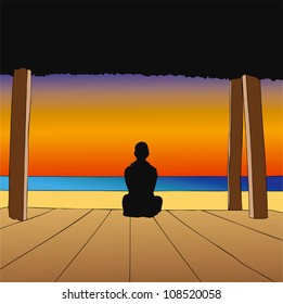 Meditation - A man sitting in front of the sea in meditation