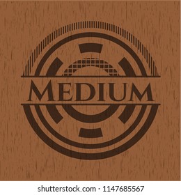 Medium badge with wooden background