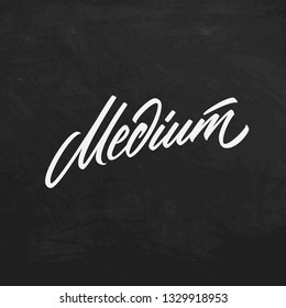 Medium roast coffee chalk lettering sign on a blackboard