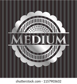 Medium silvery badge