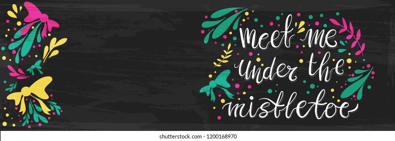 Meet me under the mistletoe hand painted lettering banner.