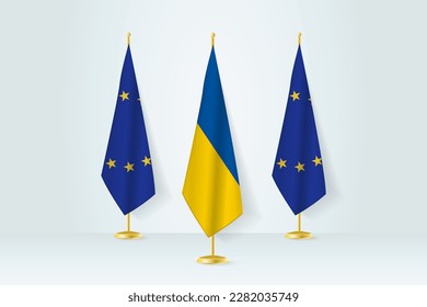 Meeting concept between Ukraine and European Union. Flags on a flag stand.