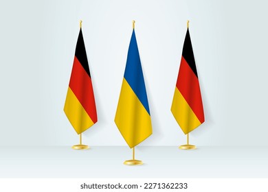 Meeting Konzept zwischen der Ukraine und Deutschland. Flaggen auf einem Flaggenstand.