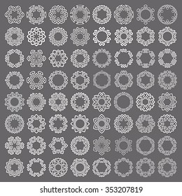 Mega set of round frames. Sixty four patterned circles. Hexagonal decorative elements for logo or monogram design. Mandalas collection of white lines with black strokes on gray background.