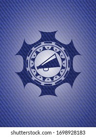 megaphone icon inside badge with denim texture
