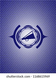 megaphone icon inside badge with jean texture