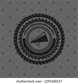 megaphone icon inside black emblem