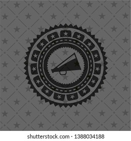 megaphone icon inside black emblem