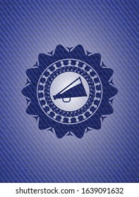megaphone icon inside emblem with denim high quality background
