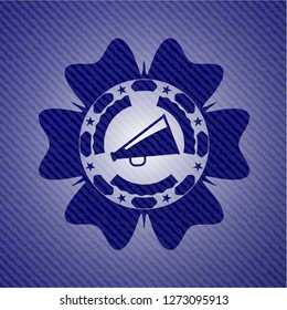 megaphone icon inside emblem with jean background