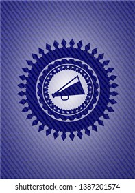 megaphone icon inside emblem with jean high quality background