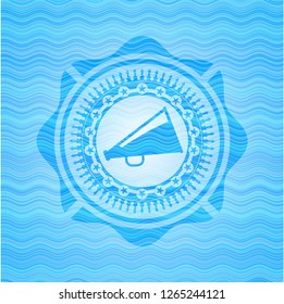 megaphone icon inside sky blue water emblem background.