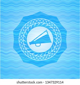 megaphone icon inside sky blue water wave badge.