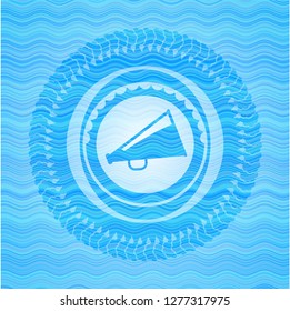megaphone icon inside water wave emblem.
