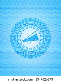 megaphone icon inside water wave style emblem.