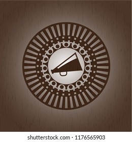 megaphone icon inside wooden emblem