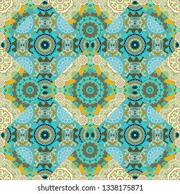 Mehndi design. Tracery seamless pattern. Ethnic colorful doodle texture in blue, green and yellow colors. Vector curved doodling background.
