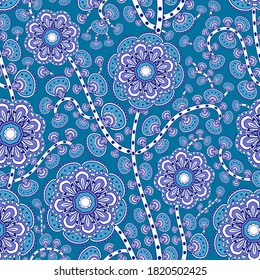 Mehndi leaves & flowers pattern grouped into twisted branches. Seamless floral texture with traditional paisley decorative element. Blue colored almond-shaped ornament. Indian textile with mandala