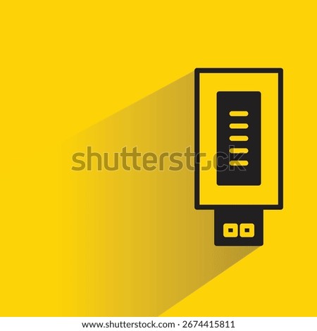 memory thumb drive icon with shadow on yellow background