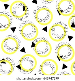 Memphis design. Geometric abstract seamless pattern. Fashionable black and white figures and yellow circles on a white background. Trend of the 80s, 90s. Modern print. Funky background.